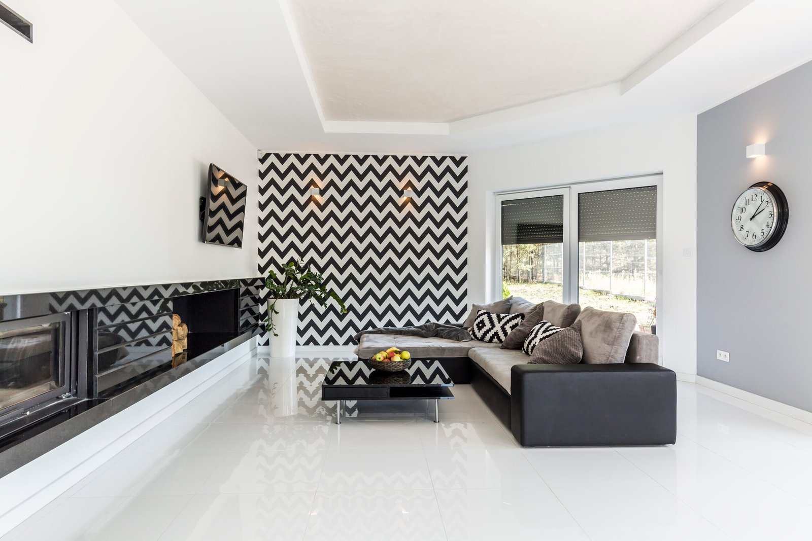 Bright living room with stylish couch and mosaic theme on the wall